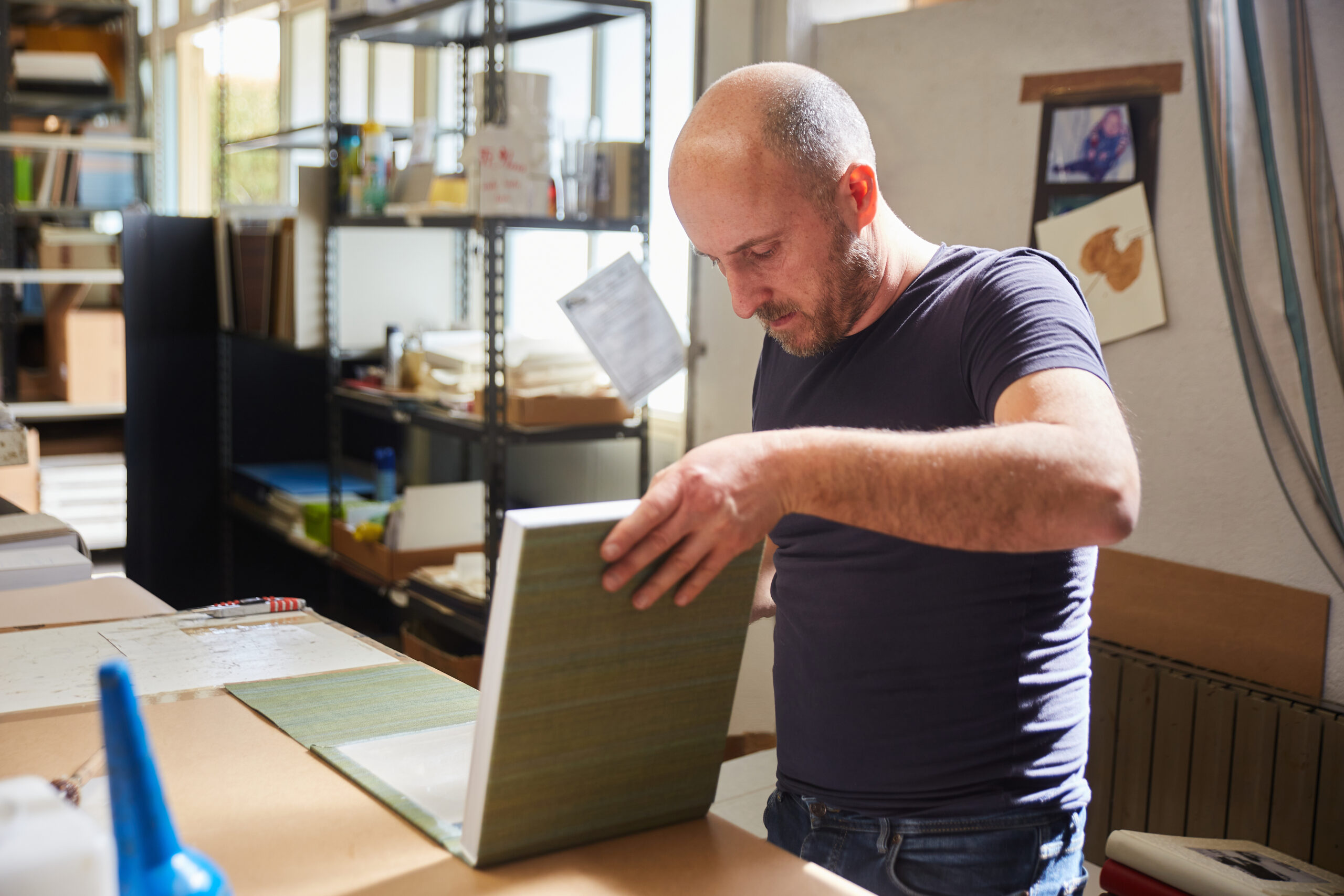 book binder working in a warehouse