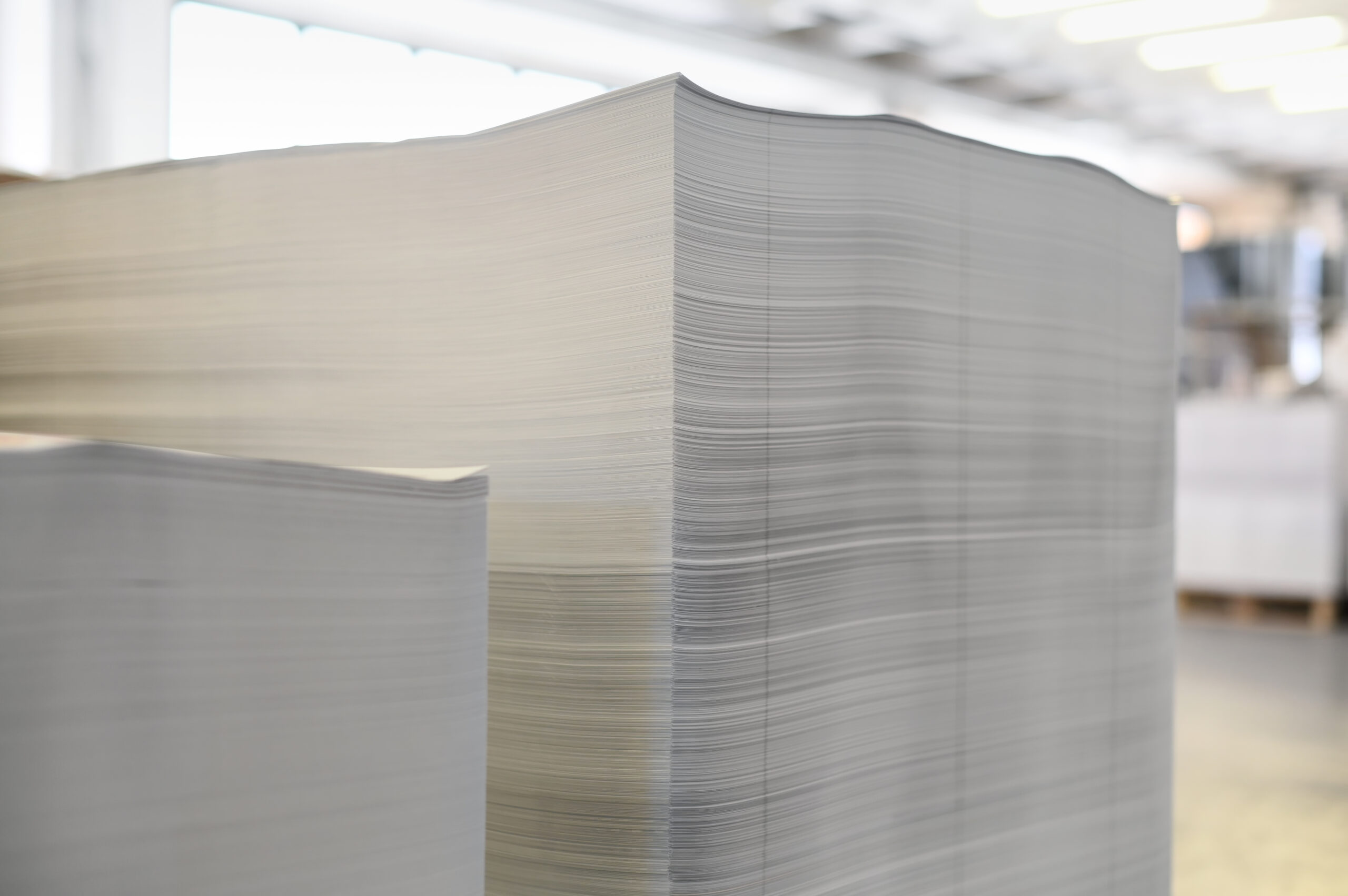 Stacks of paper sheets in print shop